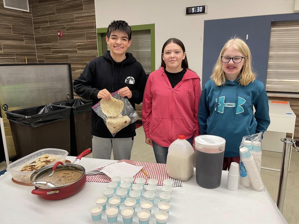 Students preparing food for others